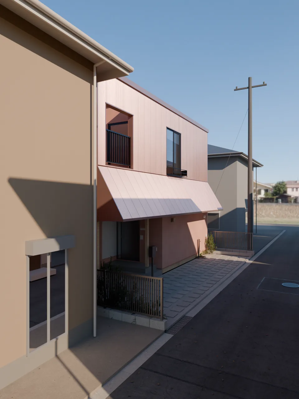 朝の外観。同じ住宅を道路の角から見た縦長の構図。玄関の庇と2階の窓が見える